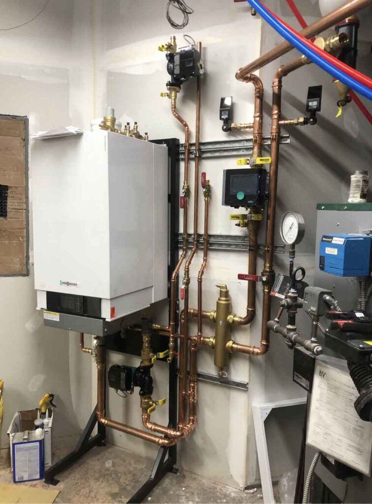 technician repairing a boiler