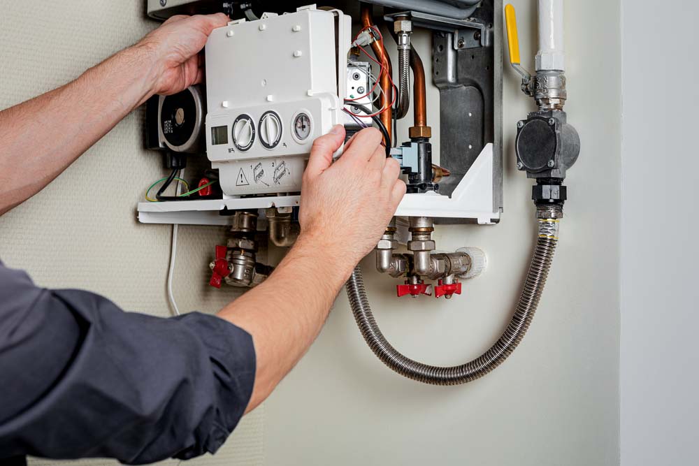 technician repairing gas boiler Byron Center, MI,